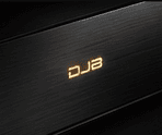 Concept visualisation of a brushed black panel with an amber DJB mark, an exploratory study for possible future control ideas.