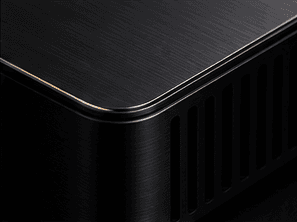 Concept visualisation of a machined corner of Reference One, showing brushed black aluminium, a fine bronze edge and a vent.