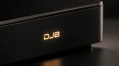 Concept visualisation, close view of the amber DJB mark on the black aluminium face of Reference One.